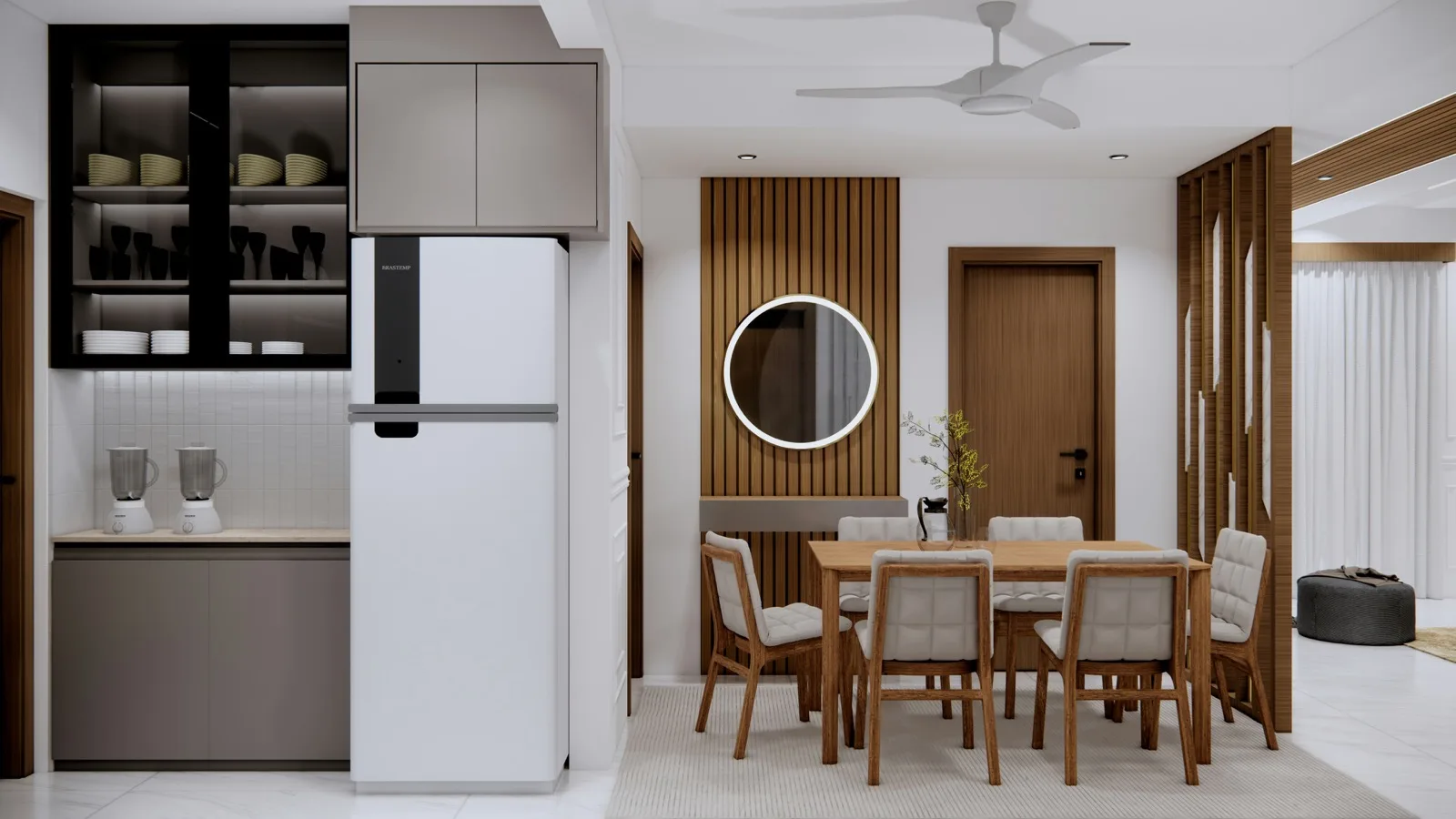 Open kitchen with dining area, island counter and warm lighting in Chennai villa